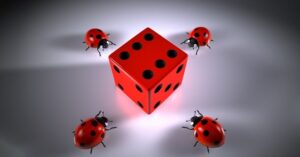 Ladybirds surrounding a dice with the number 6 displayed