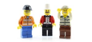Three lego people in a line